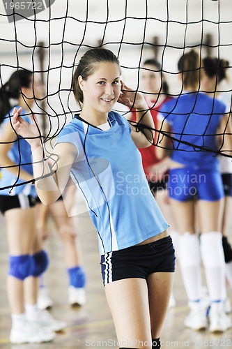 Image of girls playing volleyball indoor game