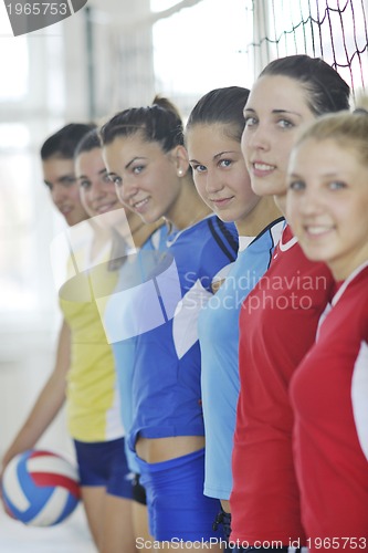 Image of girls playing volleyball indoor game