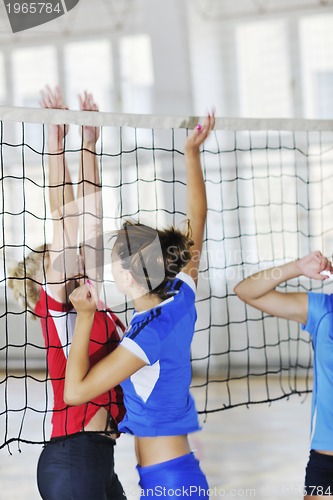 Image of girls playing volleyball indoor game