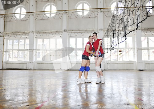 Image of girls playing volleyball indoor game