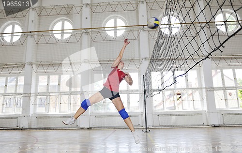 Image of girls playing volleyball indoor game