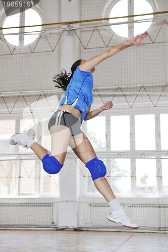 Image of girls playing volleyball indoor game