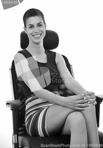 Image of brunette female  model posing on business chair