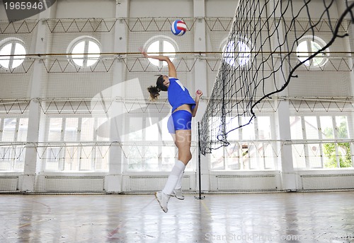 Image of girls playing volleyball indoor game