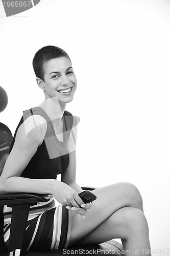 Image of brunette female  model posing on business chair