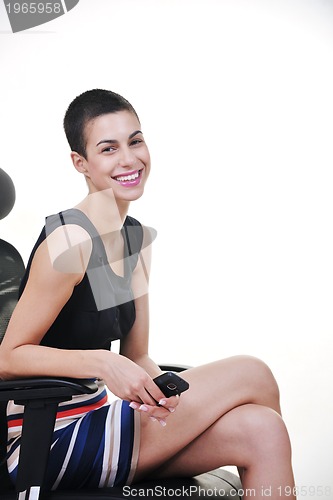 Image of brunette female  model posing on business chair
