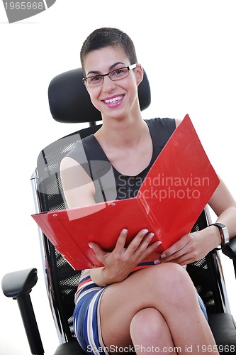 Image of brunette female  model posing on business chair