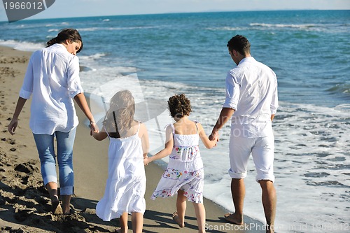Image of happy young  family have fun on beach