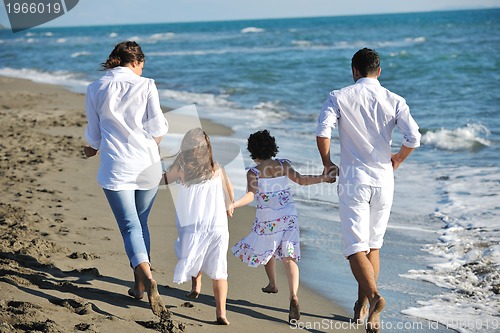 Image of happy young  family have fun on beach