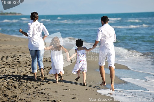 Image of happy young  family have fun on beach