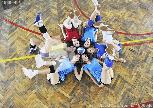 Image of girls playing volleyball indoor game