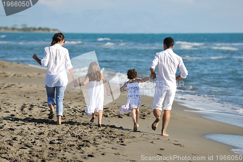 Image of happy young  family have fun on beach