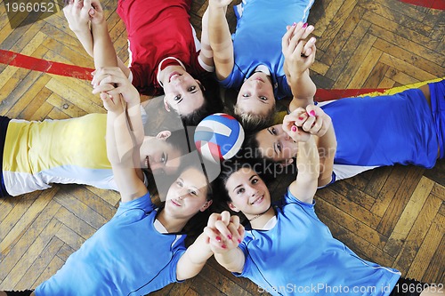 Image of girls playing volleyball indoor game