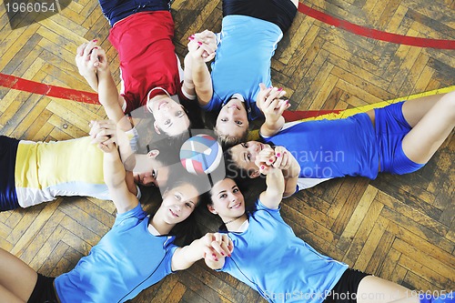 Image of girls playing volleyball indoor game