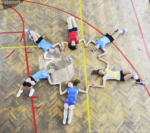 Image of girls playing volleyball indoor game