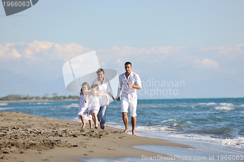 Image of happy young  family have fun on beach