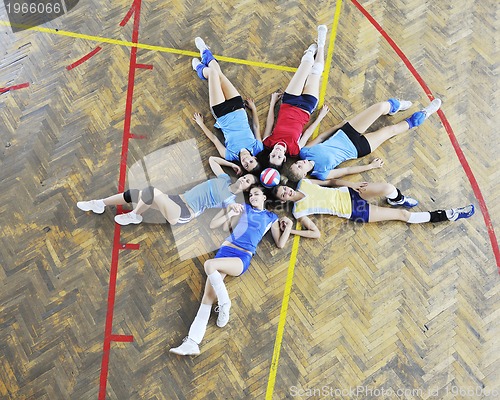 Image of girls playing volleyball indoor game