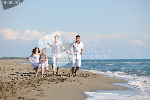 Image of happy young  family have fun on beach