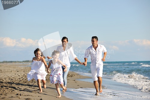 Image of happy young  family have fun on beach