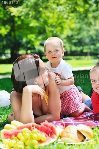 Image of woman and baby playing at park