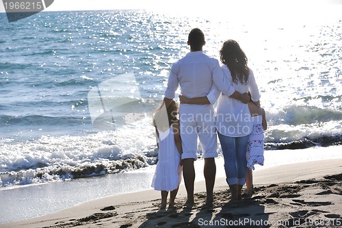 Image of happy young  family have fun on beach