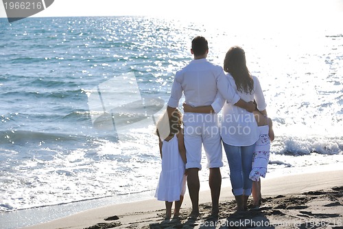 Image of happy young  family have fun on beach