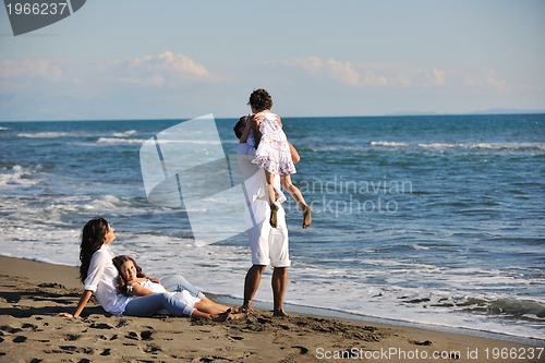 Image of happy young  family have fun on beach