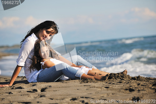Image of mom and daughter portrait on beach