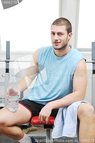 Image of man drink water at fitness workout