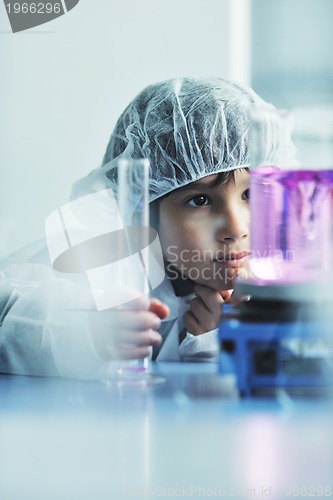 Image of little child scientist in lab