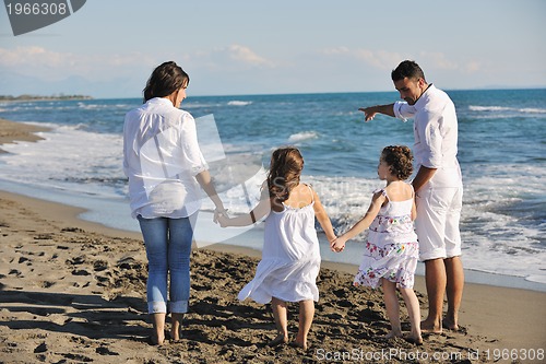 Image of happy young  family have fun on beach