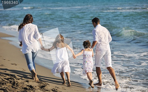 Image of happy young  family have fun on beach