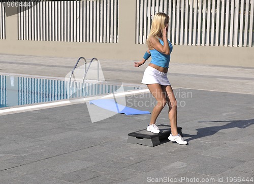 Image of fitness exercise at poolside