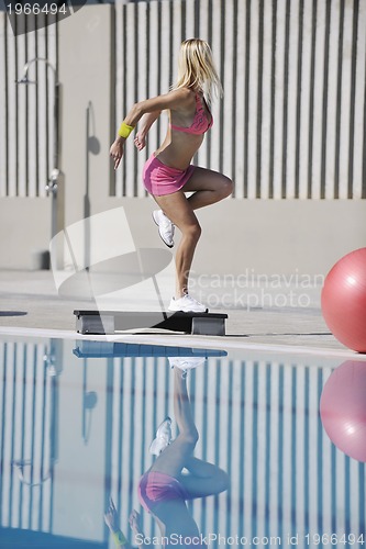 Image of fitness exercise at poolside