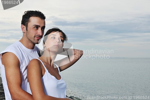 Image of happy young couple have fun at beautiful beach