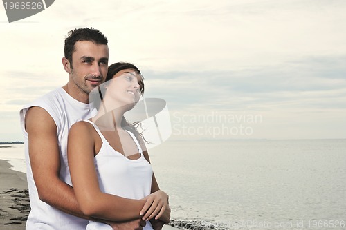 Image of happy young couple have fun at beautiful beach