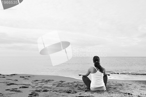Image of woman yoga beach