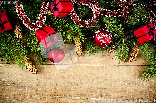 Image of christmas fir tree with pinecones and decorations 