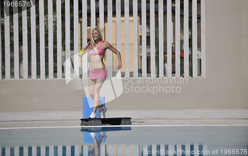Image of fitness exercise at poolside