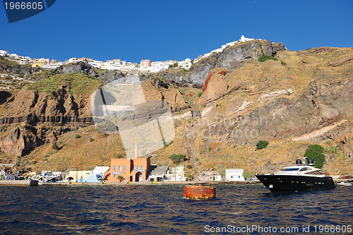 Image of santorini island coast with luxury yacht