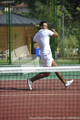 Image of young man play tennis