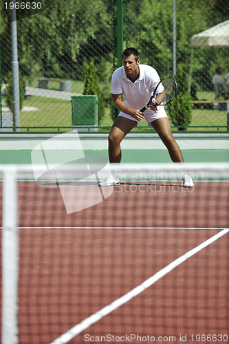 Image of young man play tennis outdooryoung man play tennis outdoor