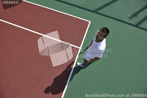 Image of young man play tennis