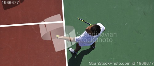 Image of young man play tennis