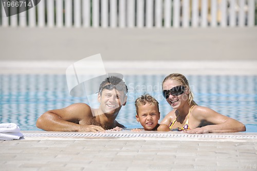 Image of happy young family have fun on swimming pool