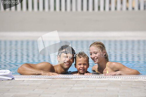 Image of happy young family have fun on swimming pool