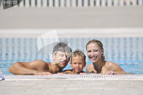 Image of happy young family have fun on swimming pool