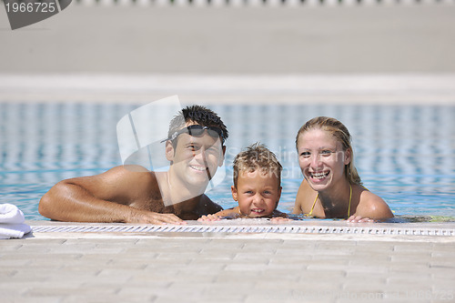 Image of happy young family have fun on swimming pool