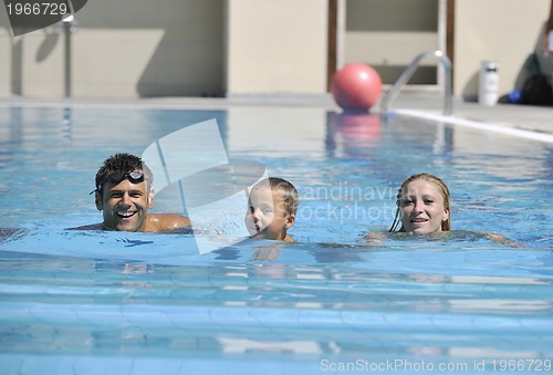 Image of happy young family have fun on swimming pool