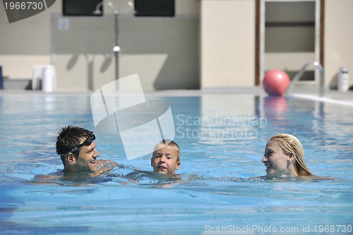 Image of happy young family have fun on swimming pool